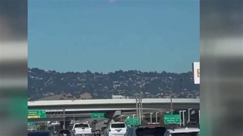 naked woman shooting on highway|Video shows naked woman running with a gun on Bay Bridge